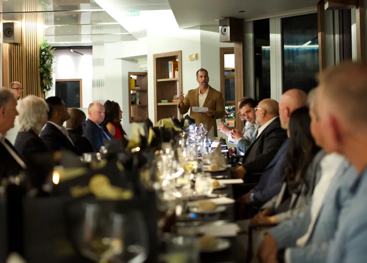 Nick Ayala speaking at a private investor dinner